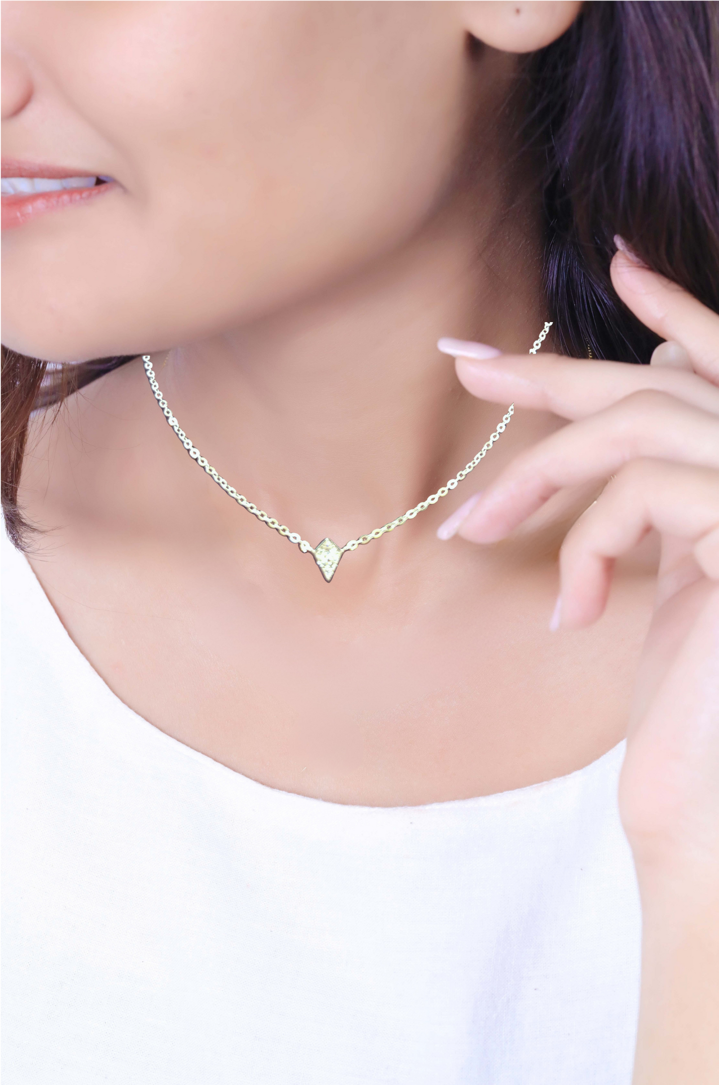 Sterling silver necklace with a diamond shape charm