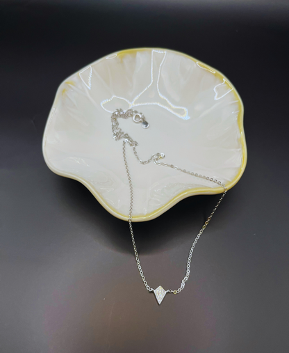 Sterling silver necklace with a diamond shape charm